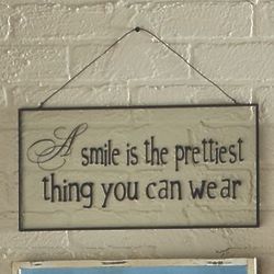 A Smile Is The Prettiest Thing You Can Wear Glass Sign