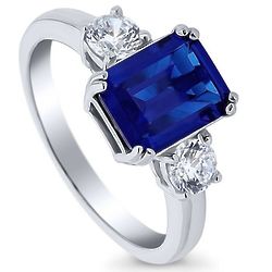Emerald Cut Simulated Sapphire and CZ 3-Stone Ring