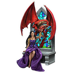 Princess and Dragon Sculpture with Illuminated Art Backdrop