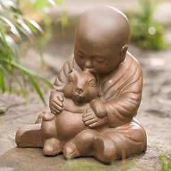 Young Monk and Bunny Sculpture