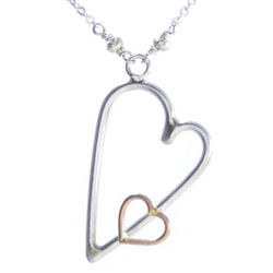 Hearts Embraced Silver and Gold Pendant