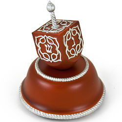 Festive Musical Dreidel with Silver Accents on Wooden Base